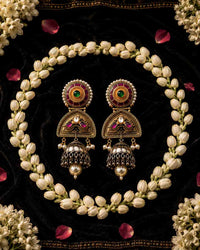 Close-up of Noorika meenakari jhumka earrings showcasing intricate craftsmanship