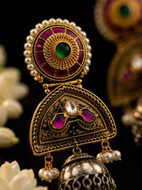Noorika bridal jhumka earrings displayed on antique tray with jasmine flowers